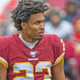 Quinton Dunbar, currently wanted on four felony counts stemming from an alleged armed robbery Wednesday night, played no part in the incident, his lawyer said Friday.
